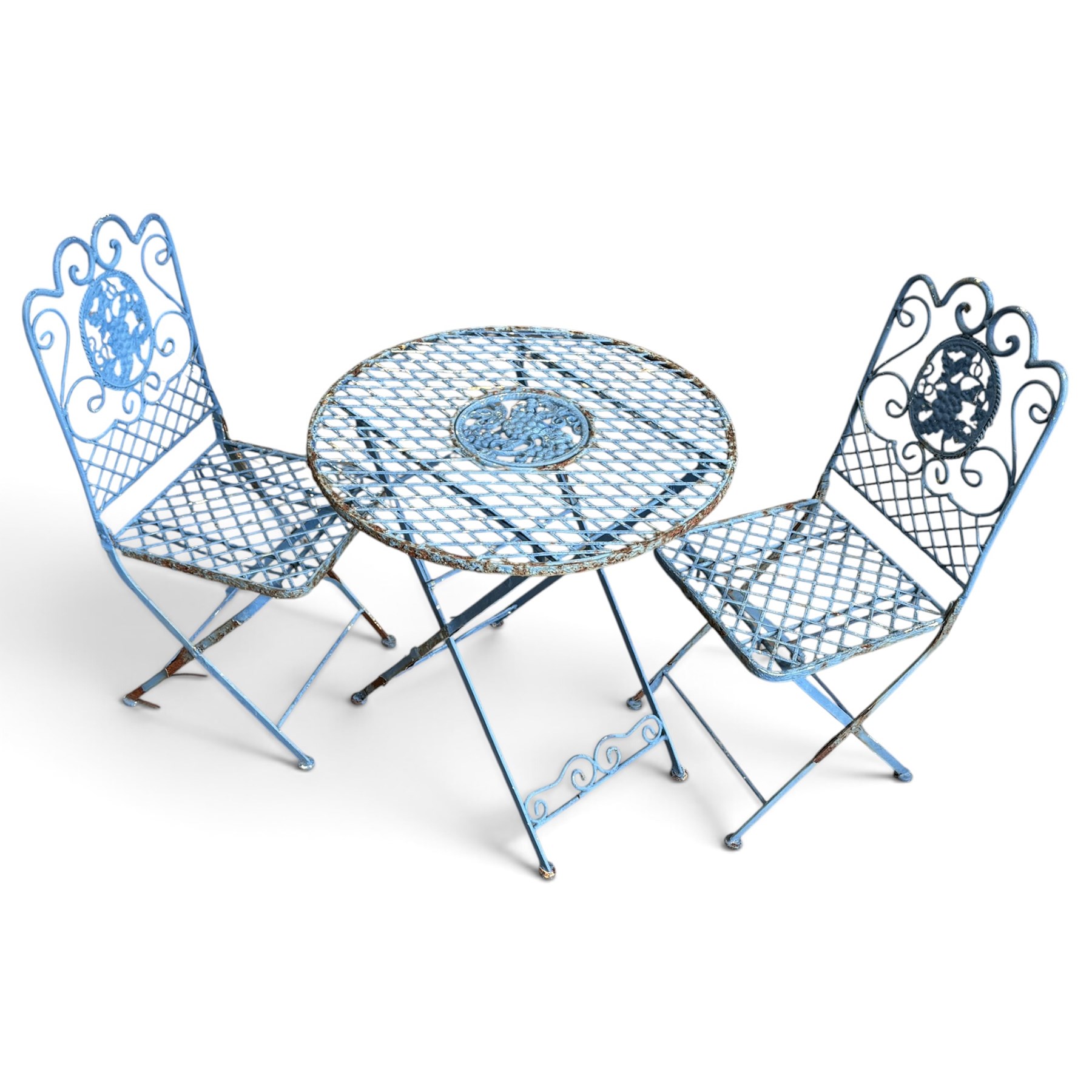 Three-piece French style blue-painted wrought iron garden bistro set, comprising a circular folding table with latticework top and central fruiting grapevine medallion (W71cm H76cm) and matching pair of chairs, with scrolling cresting rail and grapevine motif over folding X-frame base (W40cm H98cm)