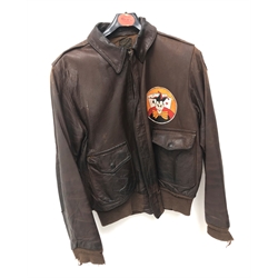  WW2 US Air Force brown leather flying jacket, back painted 'Liberty Belle', labelled Type A-2 Drawing No.30-1415, Contract No.W535 ac2356, Poughkeepsie Leather Coat Co.Inc, Poughkeepsie NY, Property Airforce US Army, size 38, marked S-0751, with hook and eye neck, press stud collar and twin pocket flaps, Talon metal zip and elasticated waist and cuffs, 8th Air Force arm patch and Joker insignia for 570th Strategic Missile Squadron  