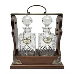 Late 20th century mahogany and silver plated two cut glass decanter tantalus, marked PB&S, with Whisky and Gin Crown Staffordshire ceramic decanter labels, H32cm