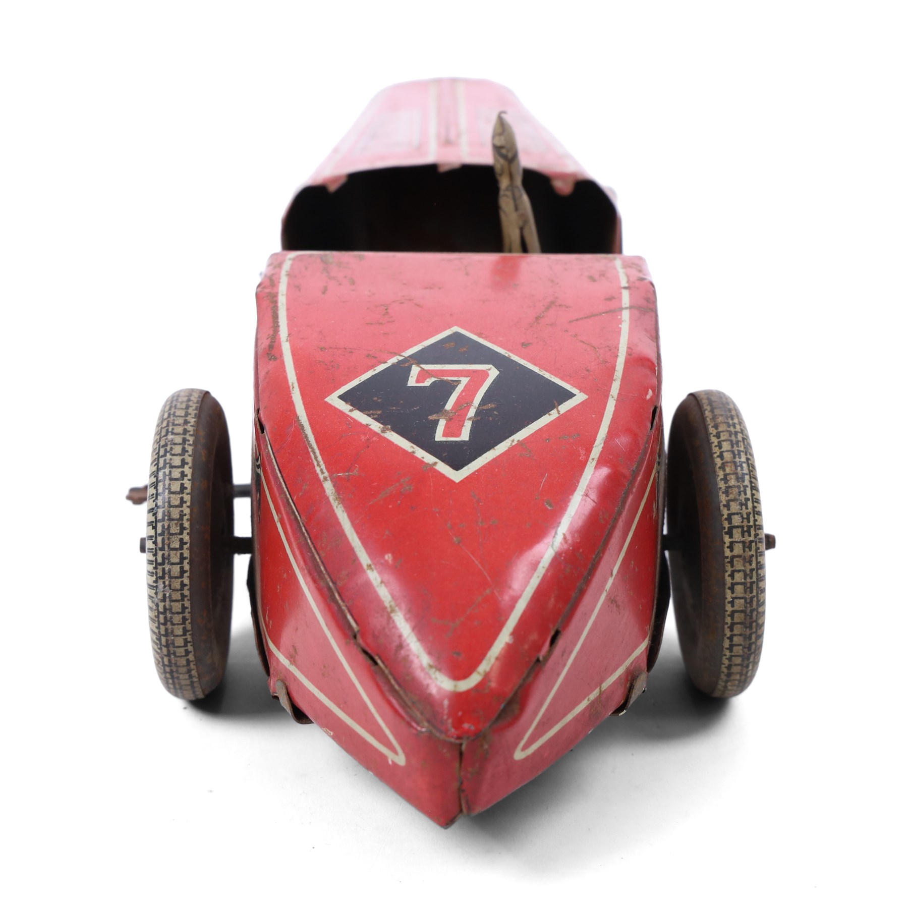 Mettoy tinplate clockwork racing car, the boat tailed red body with lithographed details, racing no. 7, with Dunlop Fort tyres, driver and key, H8cm, L32cm