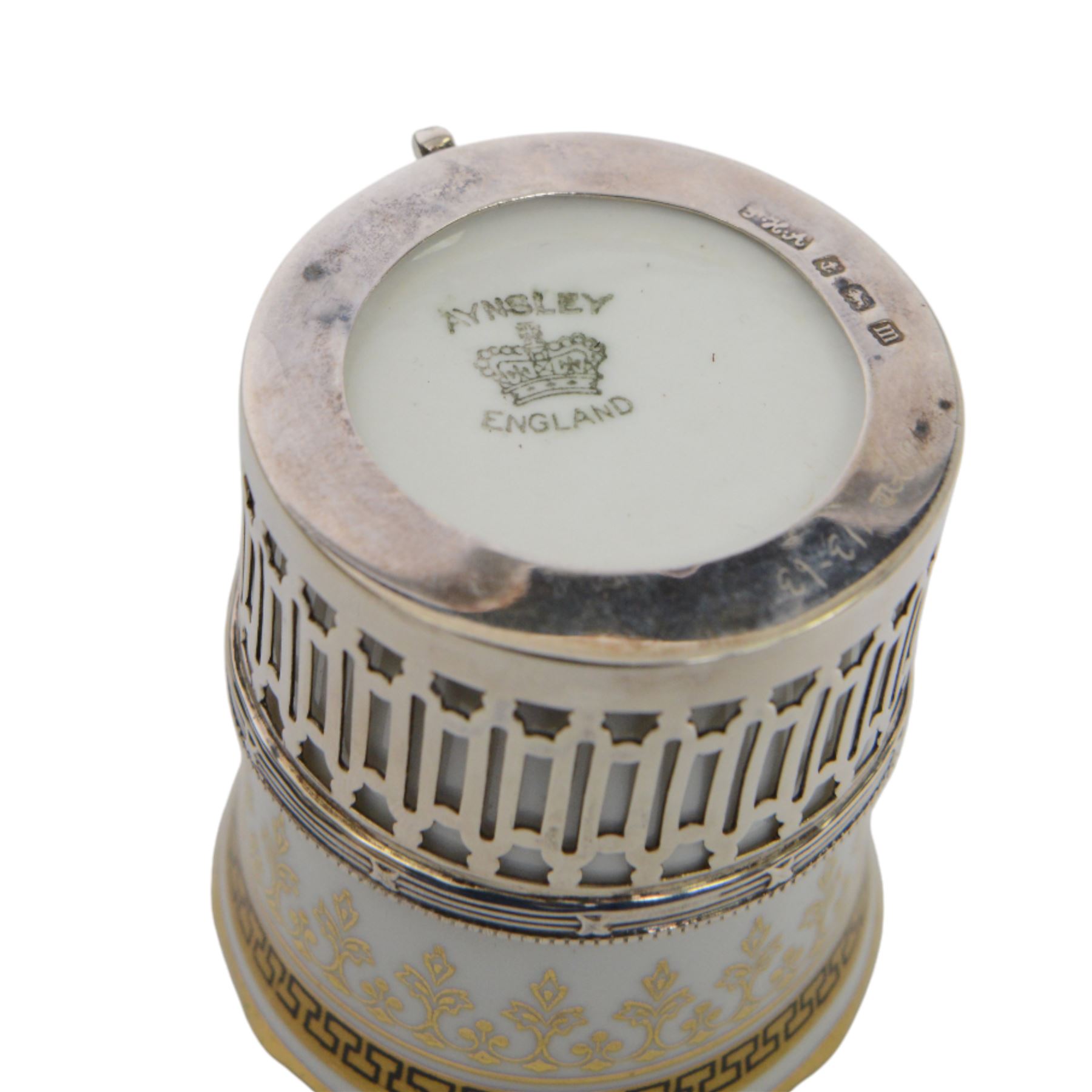 Boxed set of six Aynsley coffee cans and saucers, decorated with gilt greek key border, the cans within silver mounts, hallmarked Birmingham 1911