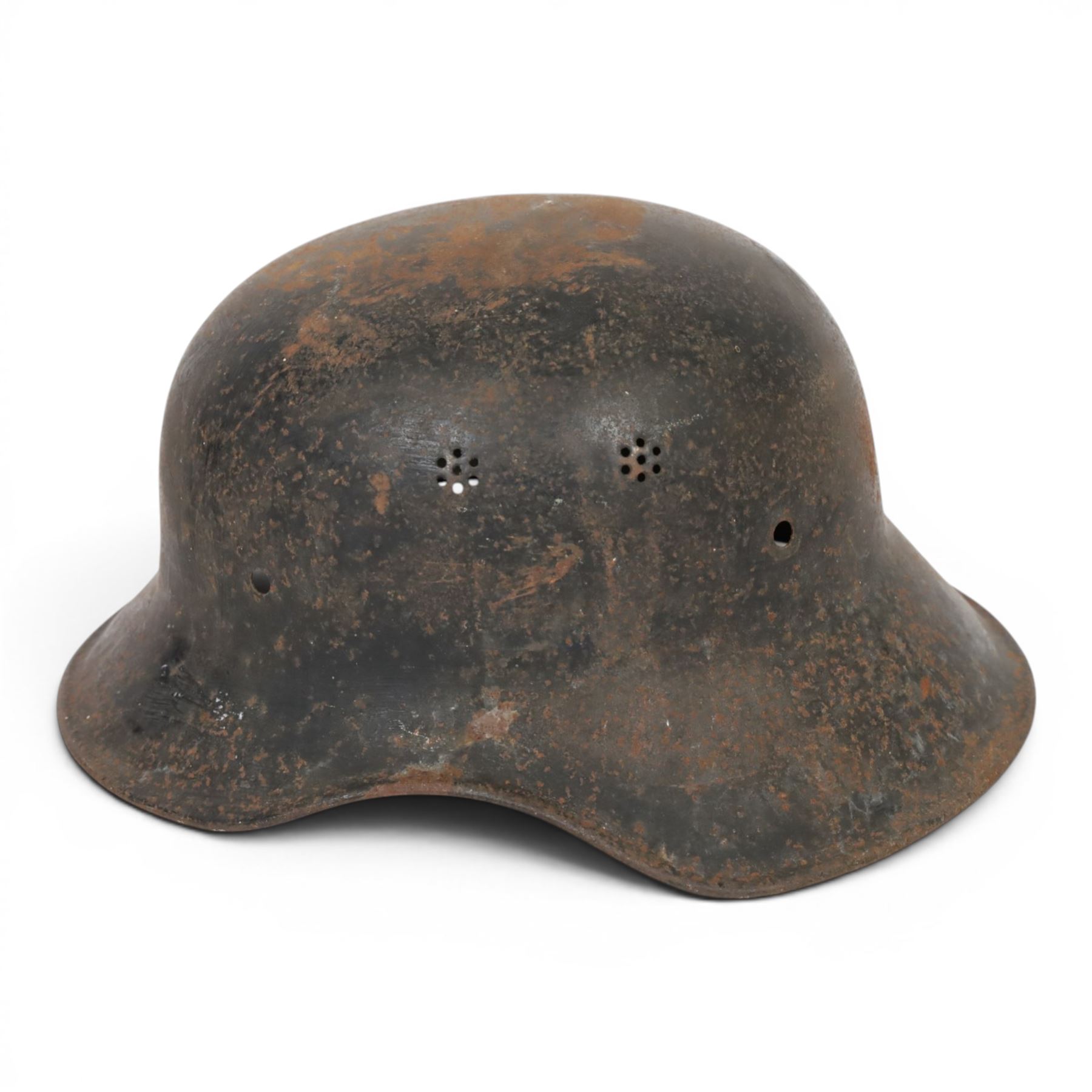 WWII German Third Reich M1940 helmet, with desert camouflage, the left inner brim stamped SE64, the back inner brim stamped 506, with leather eight tongue liner, together with German M34 helmet