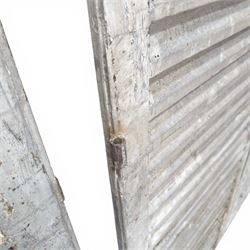 Five 19th century full height French Chateau louvre doors, pitch pine painted in cream finish, two having iron rod hinges, dimensions approx.