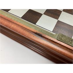 Danbury Mint 'The Fantasy of the Crystal' chess set consisting of mythical pewter chess pieces within a wooden case with chess board lid, together with 16 additional chess pieces in a wooden display case.