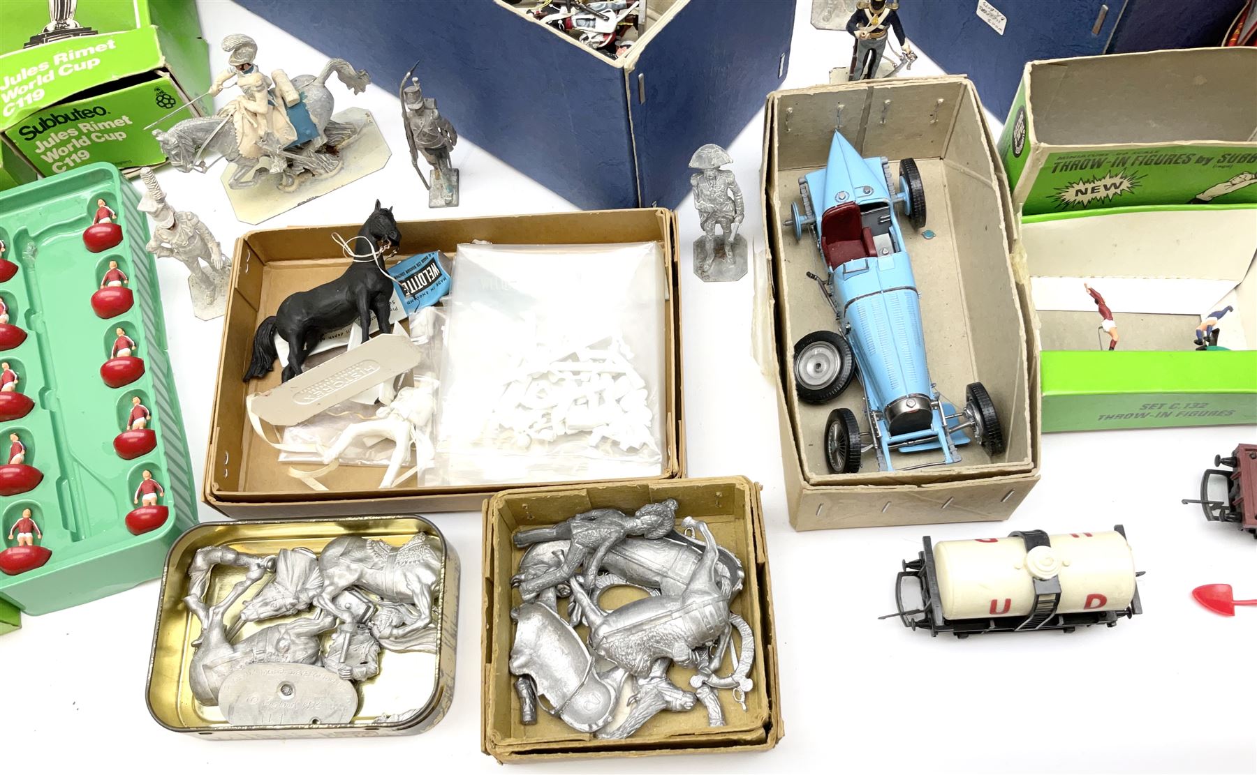 Fifty modern lead figures of mounted and foot soldiers, various period uniforms from 18th century to WW2, painted and unfinished with related paperwork; small quantity of Hornby '00' gauge model railway items and track; and four boxed Subbuteo teams etc
