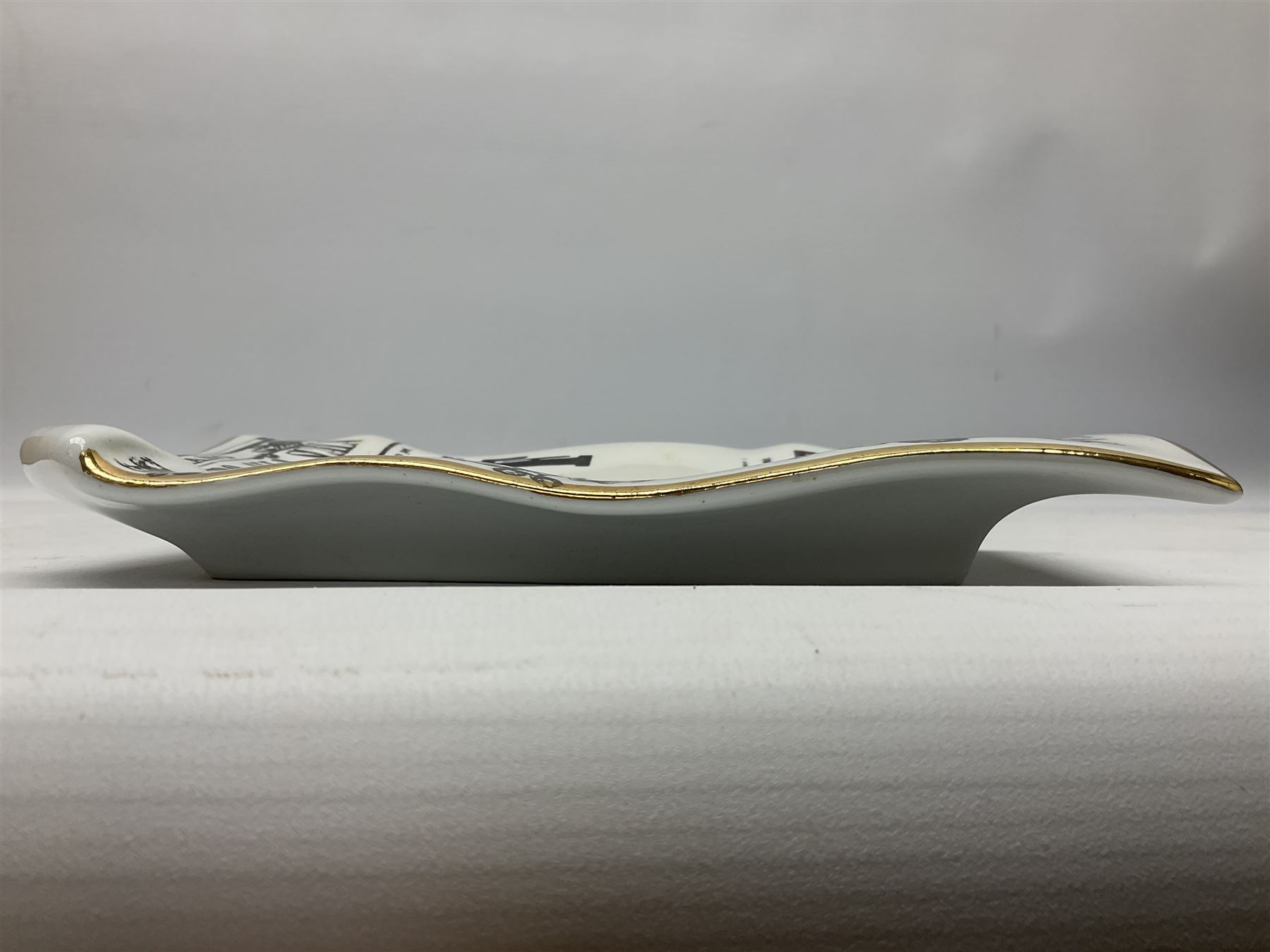 Fornasetti rectangular 'Falstaff' operatic billboard ashtray decorated with black and white text with a gilt border edge,  with printed mark beneath, H22cm 