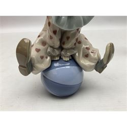 Four Lladro figures, comprising Littles Clown no 5811, Having a Ball no 5813, Pierrot with Puppy no 5277 and Pierrot with Concertina no 5279, all with original boxes, largest example H19cm