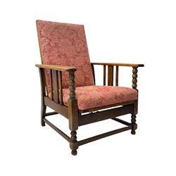 Early 20th century oak reclining armchair, upholstered in floral patterned fabric 