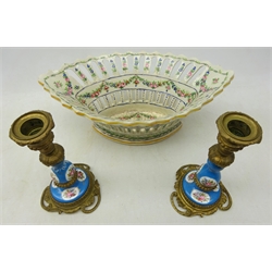  Pair Sevres style porcelain and Ormolu candlesticks, H17cm and  late 19th Century Continental porcelain chestnut basket, having pierced sides decorated with garlands of flowers, Sevres style mark to base, L32cm   