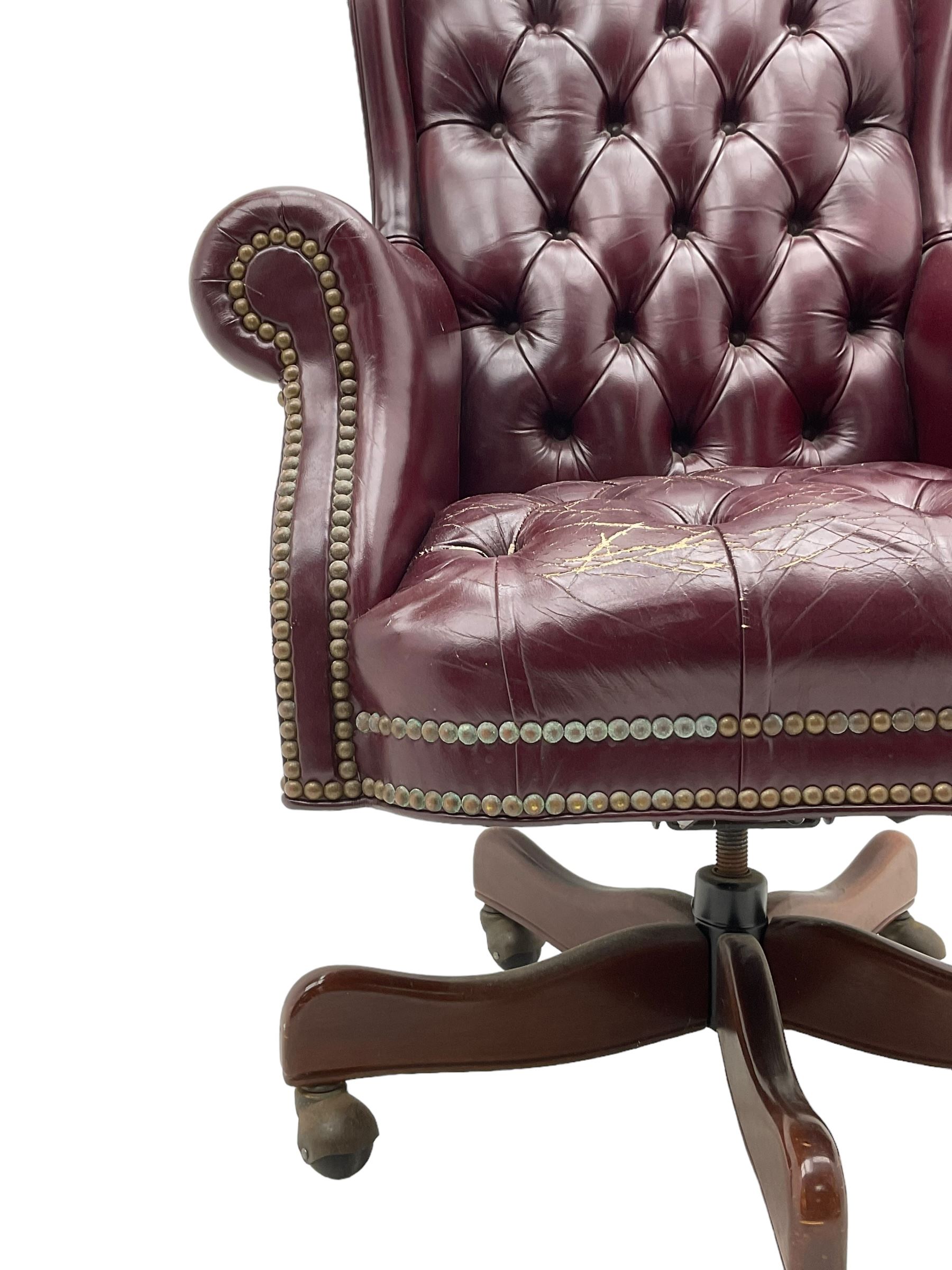Hancock & Moore - swivel office desk chair, upholstered in buttoned burgundy leather with studded bands, five-spoke base on castors