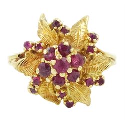 18ct gold ruby flower head cluster ring, seven round cut rubies surrounded by textured lea...