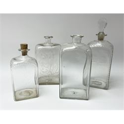 A group of four Georgian straight sided decanters, comprising two examples with cut decoration, another with etched floral decoration, and a plain example, largest example H19.5cm, smallest example H16cm. 