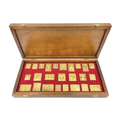 Danbury Mint sterling silver hallmarked stamp ingot set of twenty-five, housed in a fitted wooden case