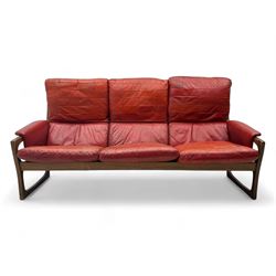Folke Ohlsson for Gimson & Slater - mid-20th century Danish teak-framed sofa, red leather upholstery with patchwork design, raised on shaped teak side supports
