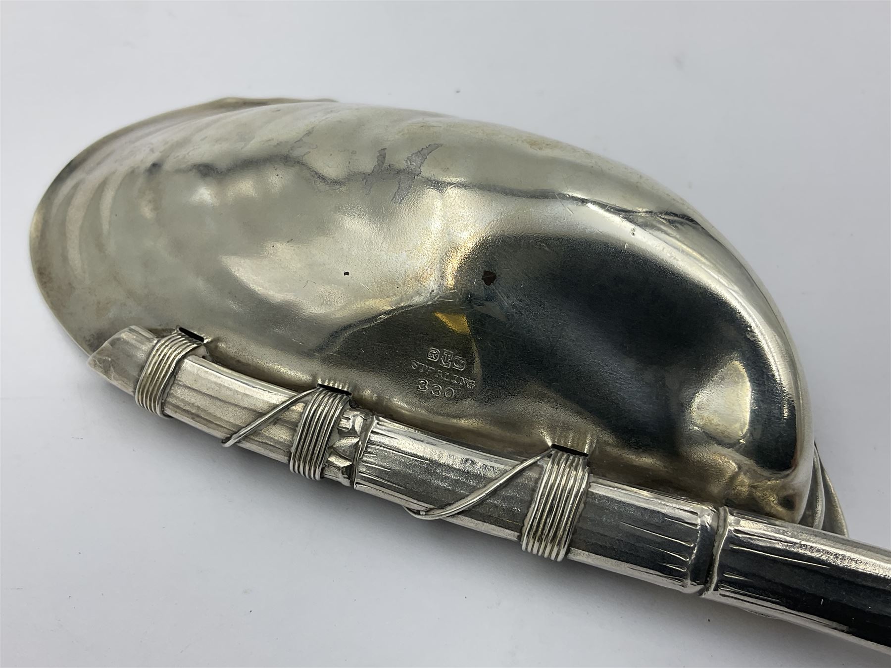 Mid/late 19th century Gorham silver serving spoon, circa 1863-1890, the bowl modelled as an oyster shell with silver gilt interior, affixed to the bamboo handle with silver twine, the bowl with marks for Gorham and impressed Sterling 330, L26.5cm
