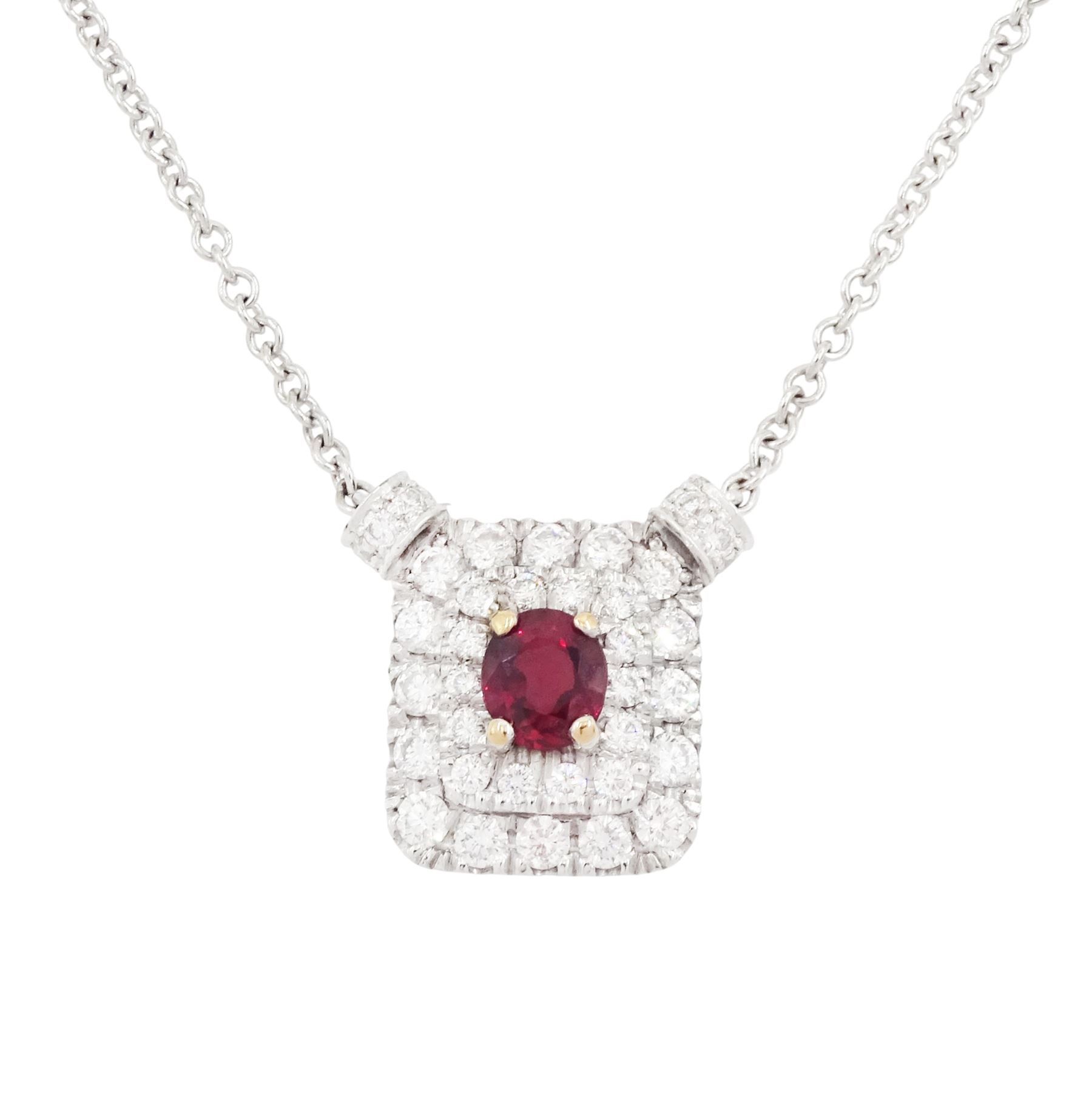 Platinum ruby diamond cluster pendant necklace, single oval cut ruby in a four claw 18ct rose gold setting of approx 0.58 carat, surrounded by two rows of round brilliant cut diamonds, London 2018, total diamond weight approx 0.84 carat, with Alan Poultney Gems report
