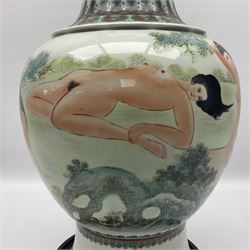 Chinese famille verte vase, of baluster form with fluted rim, the body decorated with five nude female figures amongst water and trees, with bands of polychrome foliate and floral decoration to base and rim, with six character Qianlong mark beneath, upon a circular wooden base, H41.5cm