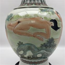 Chinese famille verte vase, of baluster form with fluted rim, the body decorated with five nude female figures amongst water and trees, with bands of polychrome foliate and floral decoration to base and rim, with six character Qianlong mark beneath, upon a circular wooden base, H41.5cm