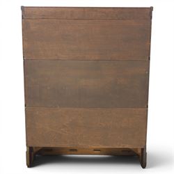 Globe Wernicke - early 20th century oak stacking bookcase, three tiers, lift up glazed doors raised on a plinth base