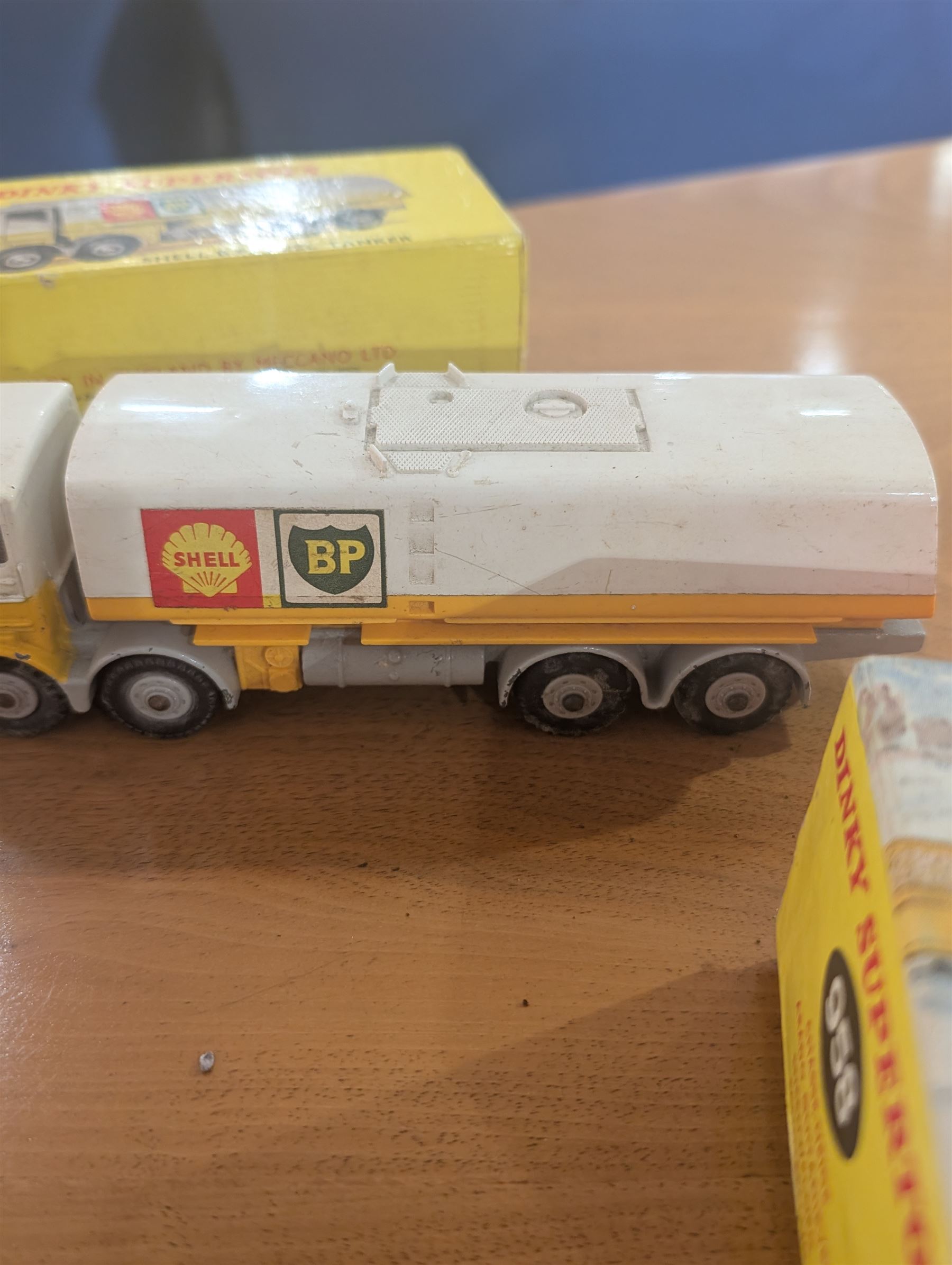 Three Dinky Toys diecast vehicles, comprising Field Marshall Tractor no. 301, Shell BP Fuel Tanker no. 944 and Snow Plough no. 958, all boxed