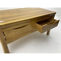 Oak coffee table, fitted with four short drawers, raised on shaped supports 