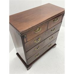 George III mahogany bachelors chest, the moulded rectangular fold over top with leather inset supported by two slide out stays, fitted with two short and three long graduating drawers, on bracket feet