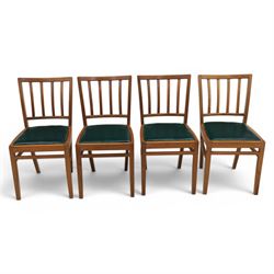 Mid 20th century teak extending dining table, together with eight teak chairs with green leather seats, extends to 154cm
