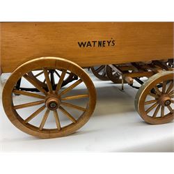 Four Melba Ware Shire horse figures and another similar, and three wood carts