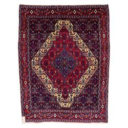 North West Persian Senneh hand-knotted rug, dark indigo field with a central bold stepped ...