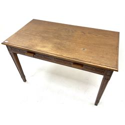 Early 20th century oak side table, moulded rectangular top over two drawers, square tapering supports with carved geometric detail