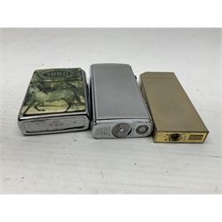 Collection of lighters, including Ronson Varaflame, Zorr Classic, Dunhill bark effect roller gas lighter, and faceted blue glass table lighter, etc