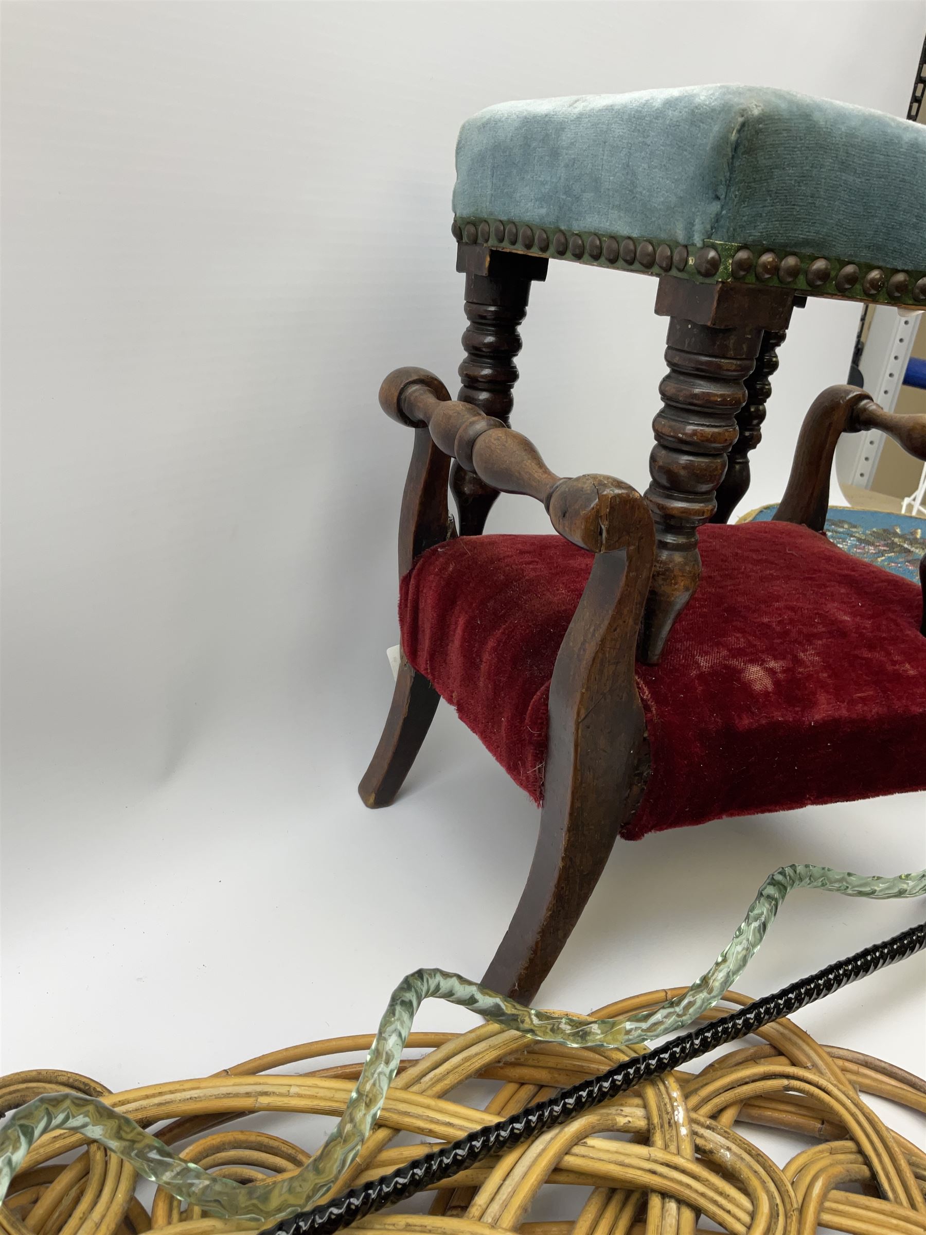 Victorian beadwork footstool with two other wooden upholstered footstools, one with turned bobbin legs, two Victorian glass frigger canes, one of twisted spiral form, and three carpet beaters