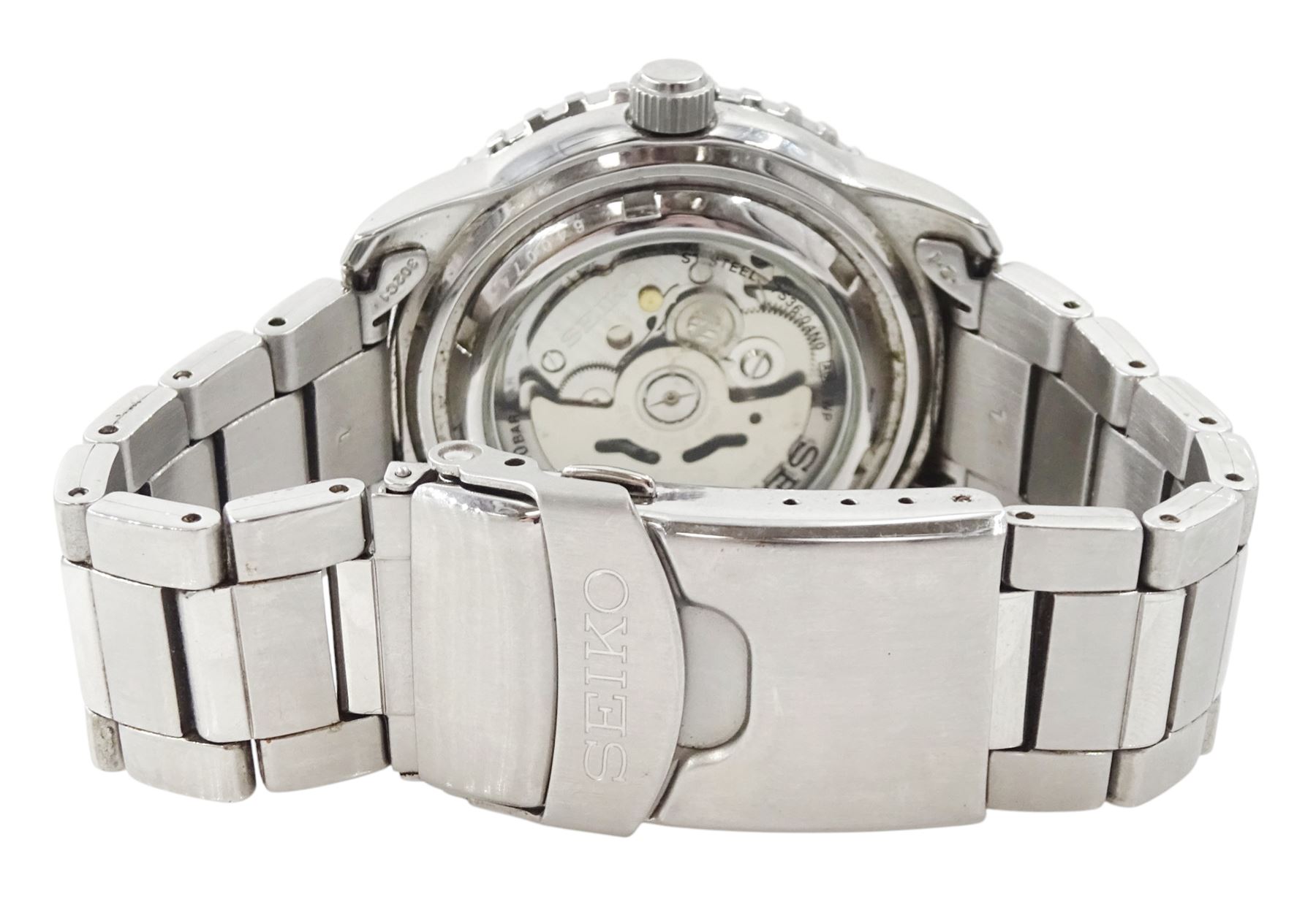 Seiko 5 Sports gentleman's stainless steel automatic wristwatch, Ref. 7S36-04N0, black dial with gilt baton hour markers and one other Seiko 5 Sports, Ref. 7S36-04X0, with grey dial and baton hour markers, both with day-date apertures and exhibition back cases, one boxed