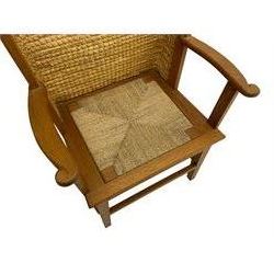 Reynold Eunson (1932–1978) for David Munro Kirkness, Kirkwall, Orkney - oak framed Orkney chair, woven straw canopy back, drop-in rush seat, the arm terminals carved with scrolls, on square tapering supports joined by plain stretchers, the front rail inscribed with makers marks