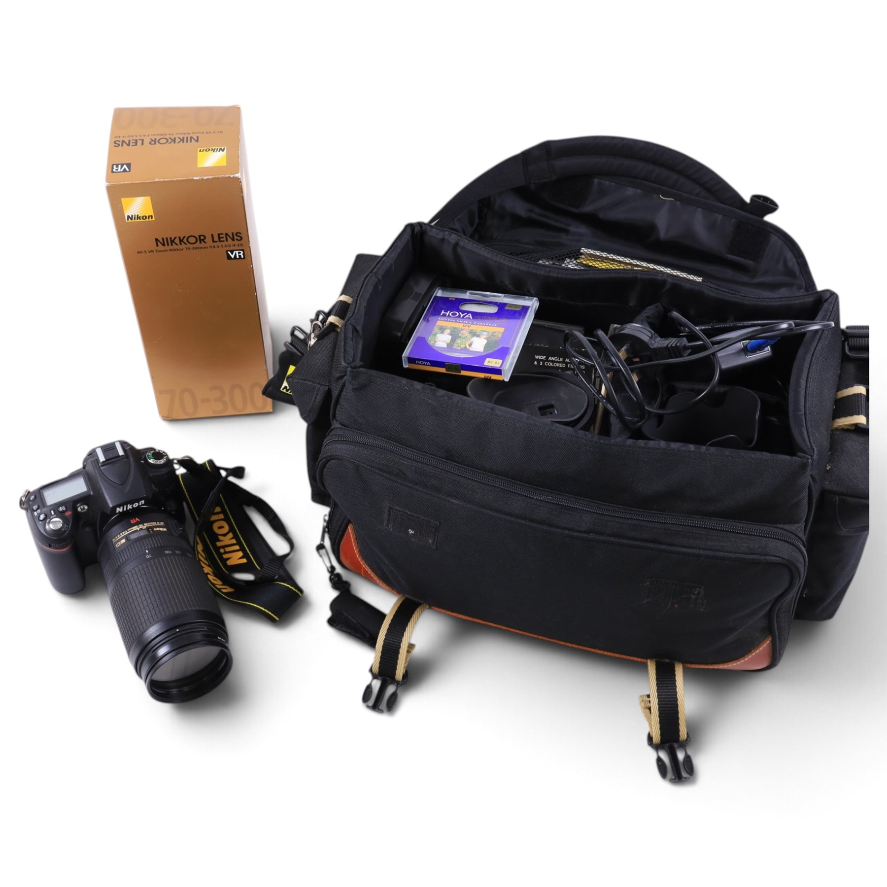 Nikon D90 DSLR camera body, serial no. 8230680, with a Nikon ED AF-S Nikkor 70-300mm 1:4.5-5.6 G lens, serial no. 3102829, with battery and Nikon Quick Charger, in carry case with other accessories including hoods, caps and filters