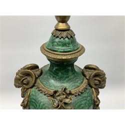 Pair of Neo-Classical style malachite effect table lamps, the urn shaped bodies with applied bronzed ram masks, and ribbon and floral swags, each upon an acanthus mounted circular spreading foot, and malachite finished plinth with applied bronzed panels of classical female figures, and four compressed circular feet, not including fixtures H47cm