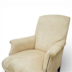 Sofas & Stuff - pair of ‘Thistle’ armchairs upholstered in neutral fabric, each with gently sloping back, padded scroll arms with close-set stud detailing, loose seat cushions, raised on turned wooden legs with brass castors