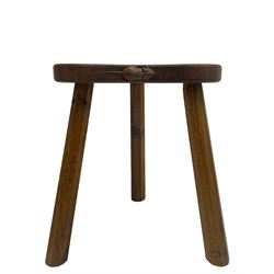 'Mouseman' oak three-legged stool, kidney shaped dished seat carved with mouse signature to edge, by Robert Thomas of Kilburn