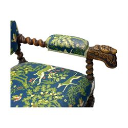 19th century Carolean design oak armchair, upholstered in a vibrant fabric depicting woodland and wildlife scenes, carved lion mask arm terminals, raised on barley twist supports united by H-stretcher