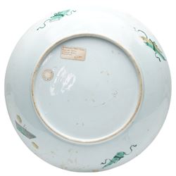 Chinese Kangxi famille verte dish, decorated with Laozi seated on the back of a buffalo greeting a bowing figure, D27cm