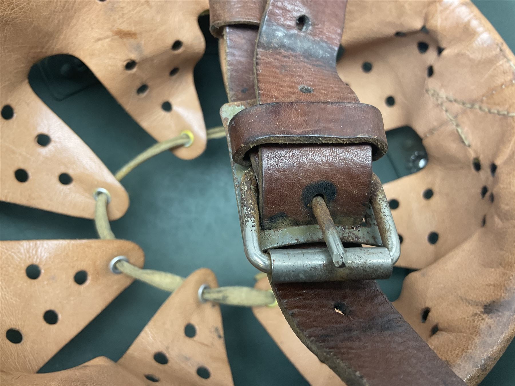 1960s Italian parachutist helmet with liner; camouflage paintwork with parachutist crest to the front