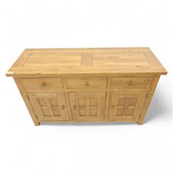Contemporary solid oak sideboard, rectangular plank top above three drawers and three panelled cupboard doors, fitted with wooden knop handles