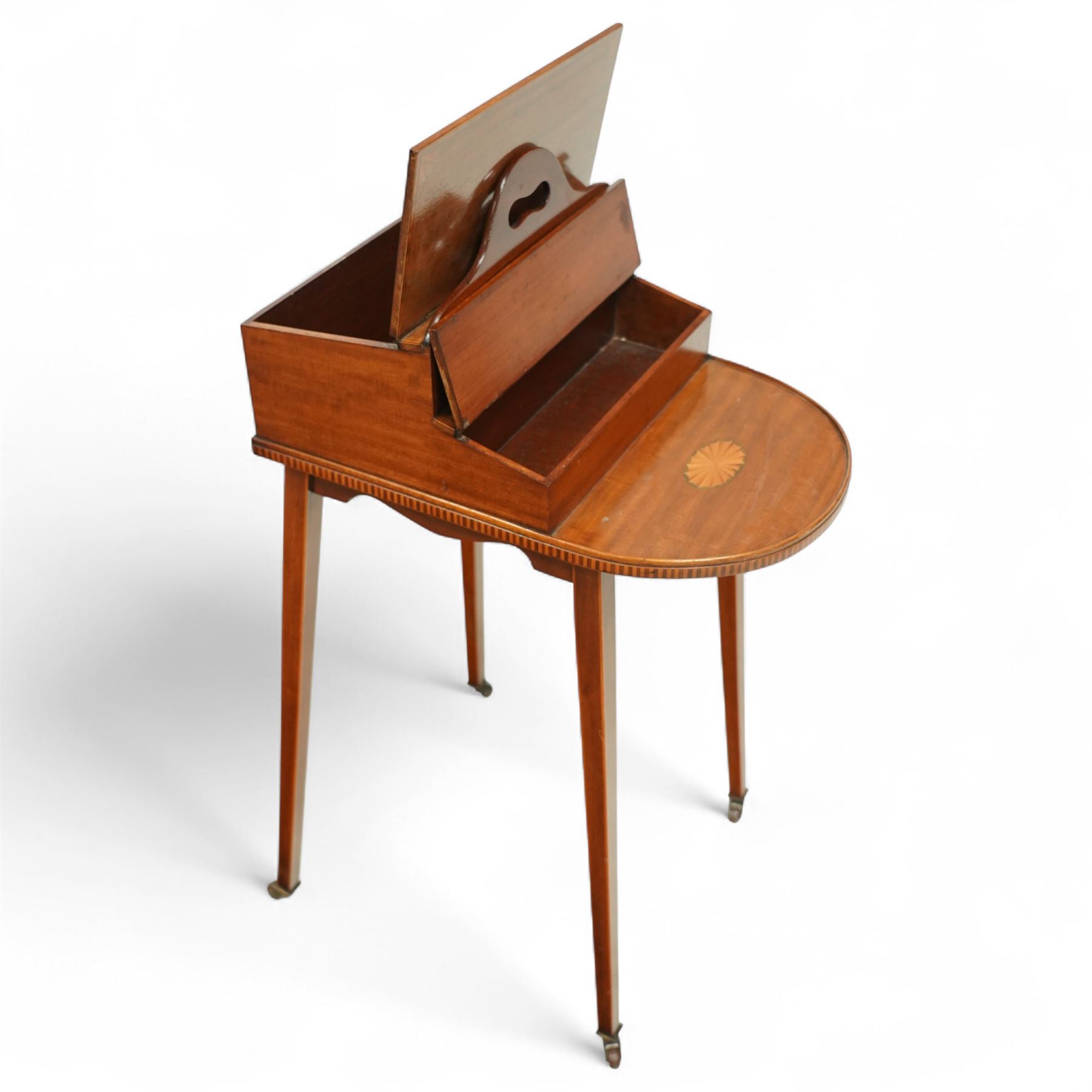 Early 20th century Edwardian mahogany work table, oval top inlaid with satinwood shell motif and stringing, hinged compartment fitted with letter rack and divided interior, on tapering legs with brass castors