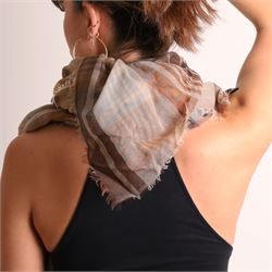 Mulberry - three scarves, comprising grey scarf with repeating tree motif, tan, cream and grey check scarf, and charcoal grey scarf with oversized ‘Mulberry’ motif, all with fringed edges (3)