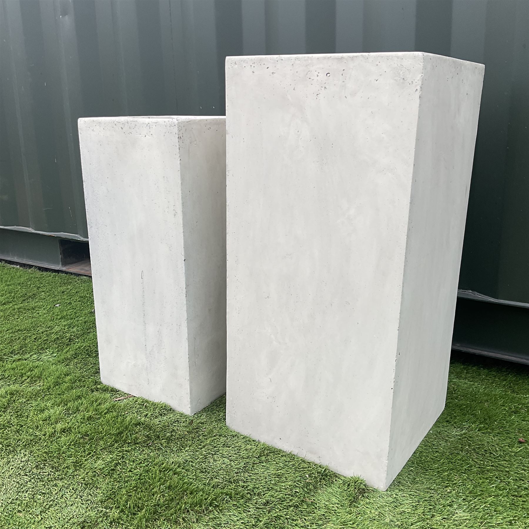Graduating pair concrete effect square planters (largest - 34cm x 34cm, H71cm), and a tall garden urn planter with scrolled metalwork mount (H93cm) - THIS LOT IS TO BE COLLECTED BY APPOINTMENT FROM DUGGLEBY STORAGE, GREAT HILL, EASTFIELD, SCARBOROUGH, YO11 3TX