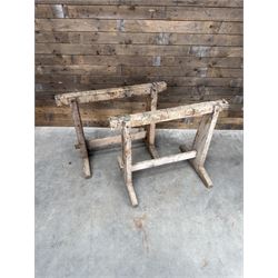 Pair of late 19th century pitch pine trestles, square tapering form in stripped finish