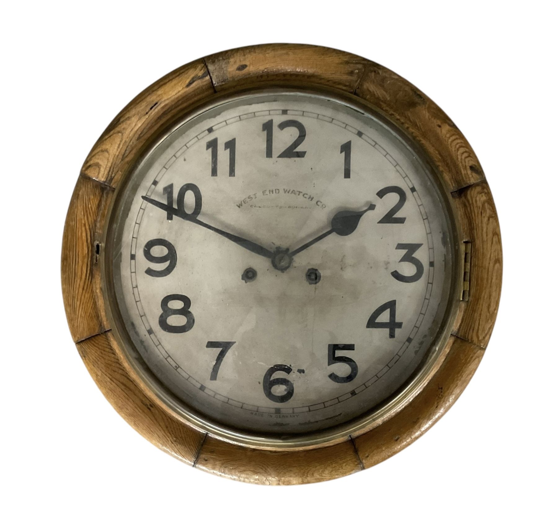 Early 20th century German spring driven striking wall clock with a 12” painted dial and spun bezel.