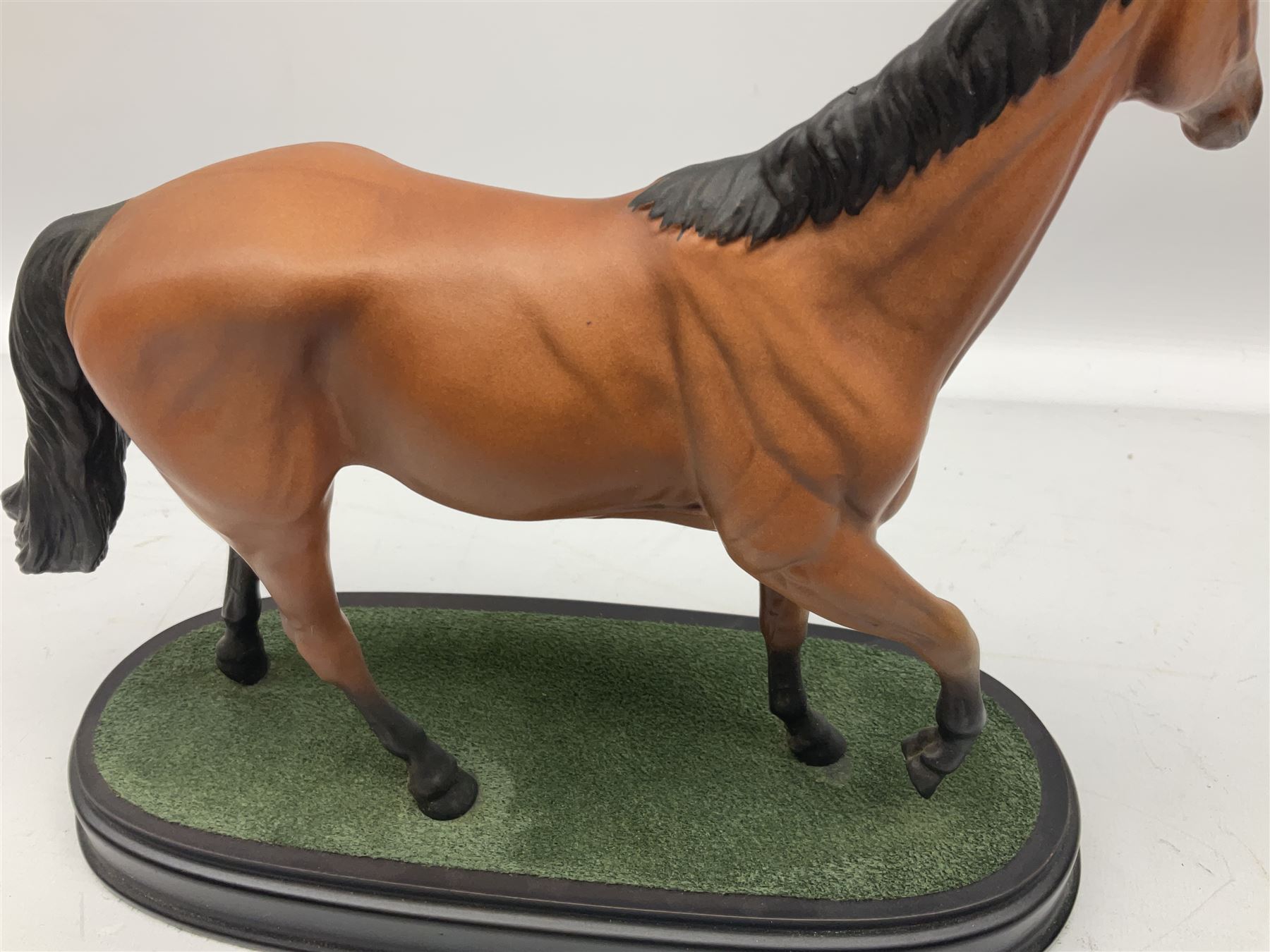 Beswick 'Mill Reef' horse figure, on a wooden plinth together with Beswick Ware horse figure 'Red Rum' on wood plinth, both with printed mark beneath