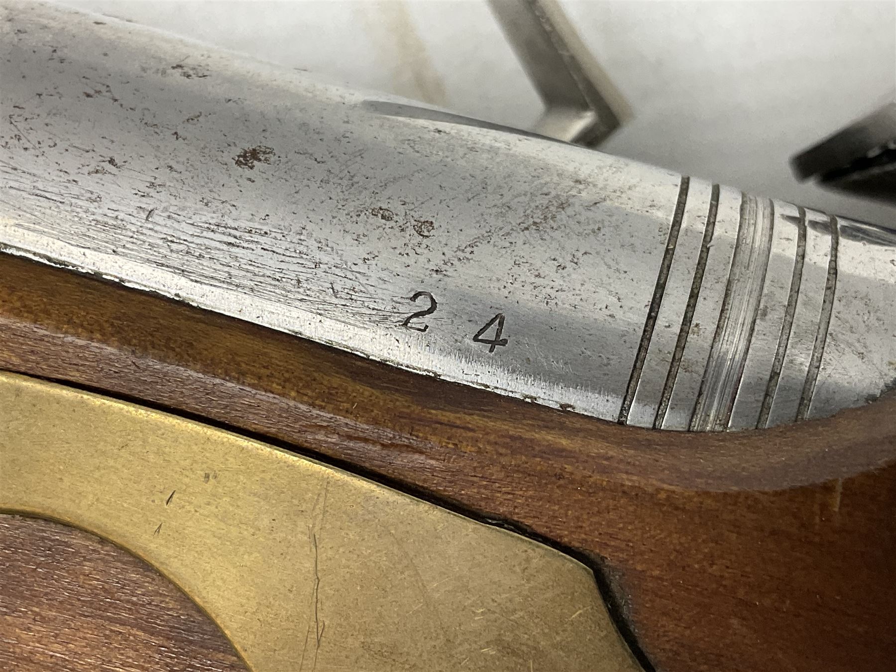 Reproduction non-firing flintlock pistol with brass skull crusher butt, the lock-plate inscribed 'Tower' and 'GR' L40cm; Sabre Japan Original Bowie Knife in sheath; and Indian embossed nickel two-piece walking cane (3)