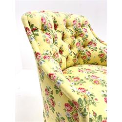 20th century button backed tub shaped bedroom chair upholstered in vintage floral fabric on yellow ground